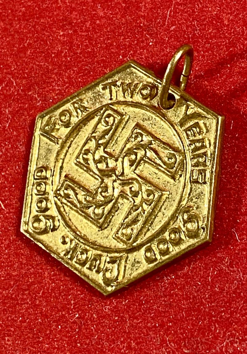 Pre WW2 Gilt Metal Swastika Token “FOR TWO YEARS OF GOOD LUCK - GOOD LUCK” c1930