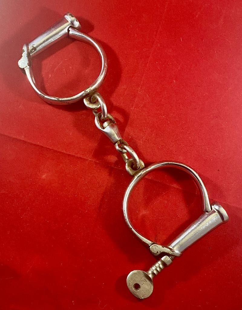 Pair of British Police Hiatt “D” Type Handcuffs with a Key c1920